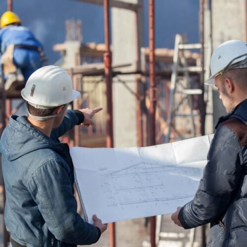 engineers Two engineers working in a construction site